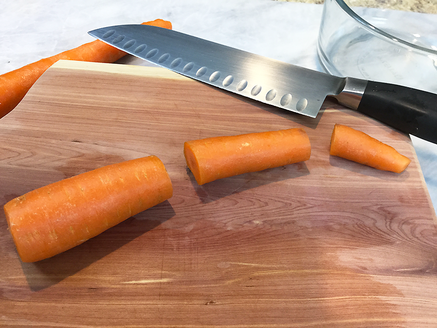 Wash and cut carrots into 3 inch sections.